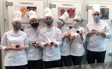 Photography of the EHL's students with lava cakes