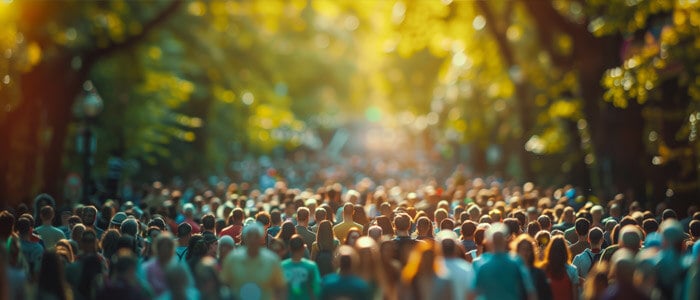 a bustling street scene featuring a crowd of people walking together