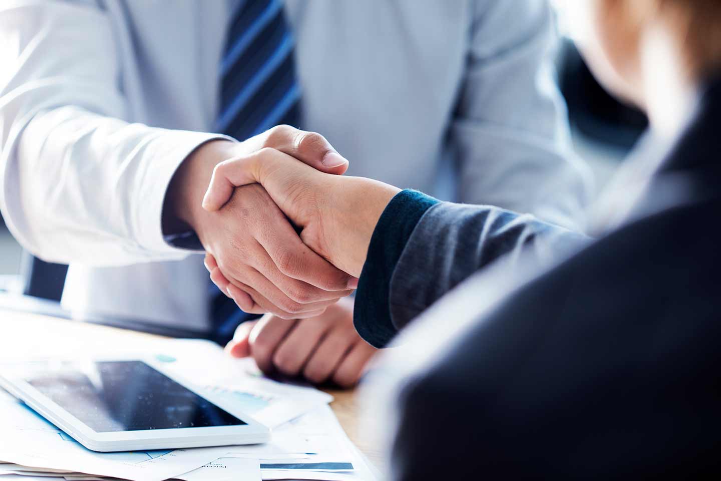 two investors shaking hands